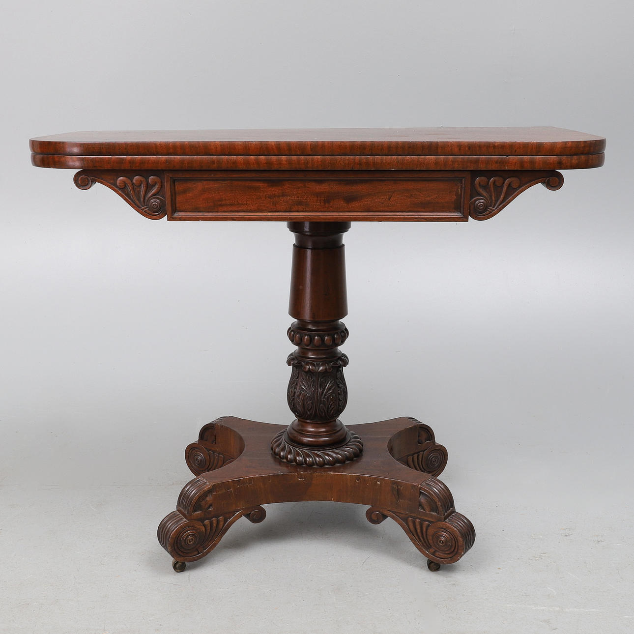 A LATE REGENCY MAHOGANY FOLD-OVER TOP TEA TABLE.