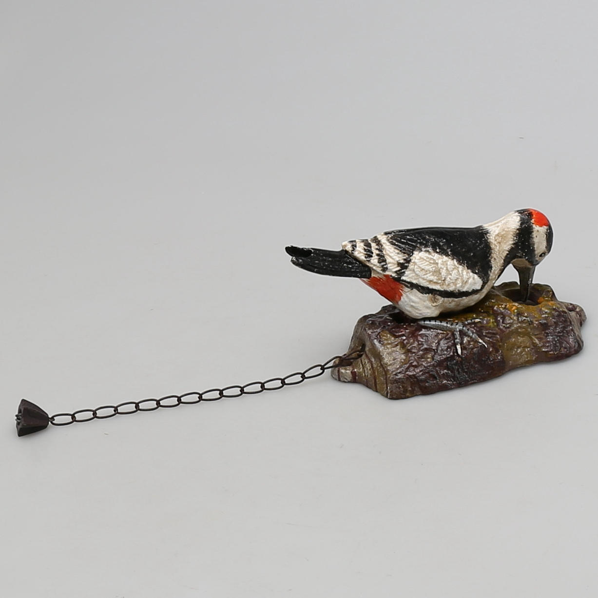 DÖRRKLÄPP i gjutjärn. Hackspett.