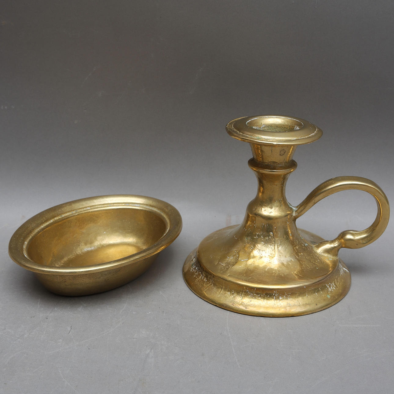 BRONZE OBJECTS, 2 pcs. candlestick and bowl, 19th/20th century.
