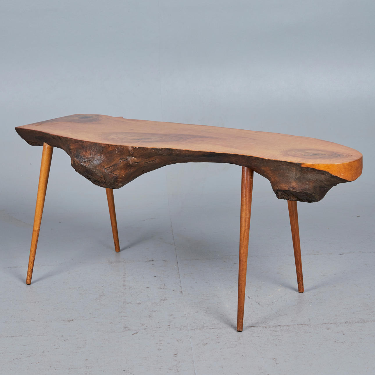 CARL AUBÖCK. In the manner of. Coffee table / side table, walnut, 1950s.