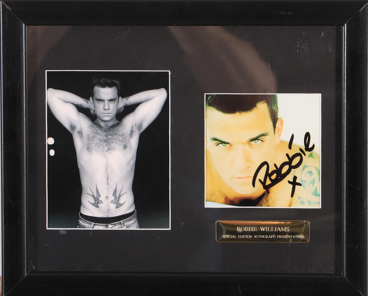 ROBBIE WILLIAMS. Signed photograph, framed with certificate.