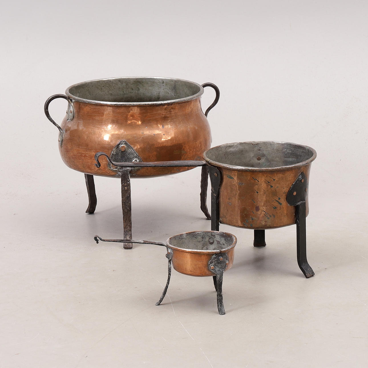 POTS ON LEGS, 3 pcs, copper, 19th century.