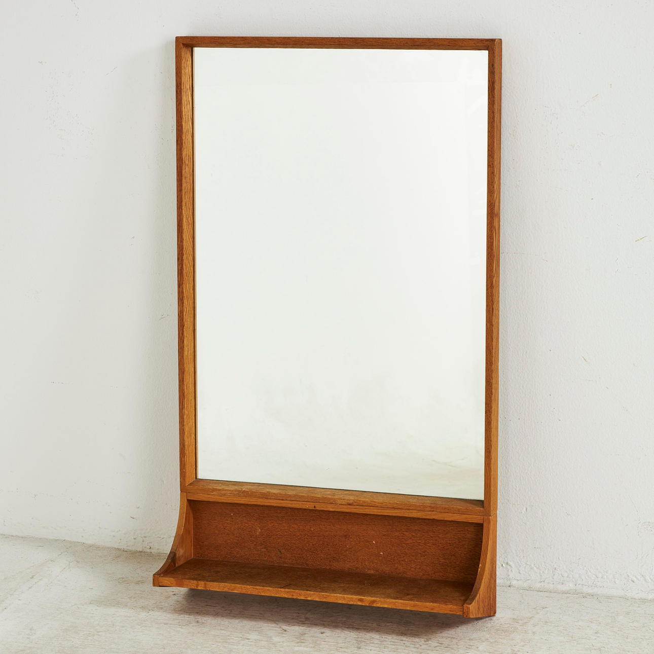MIRROR, mid-20th century, oak frame, small shelf below.