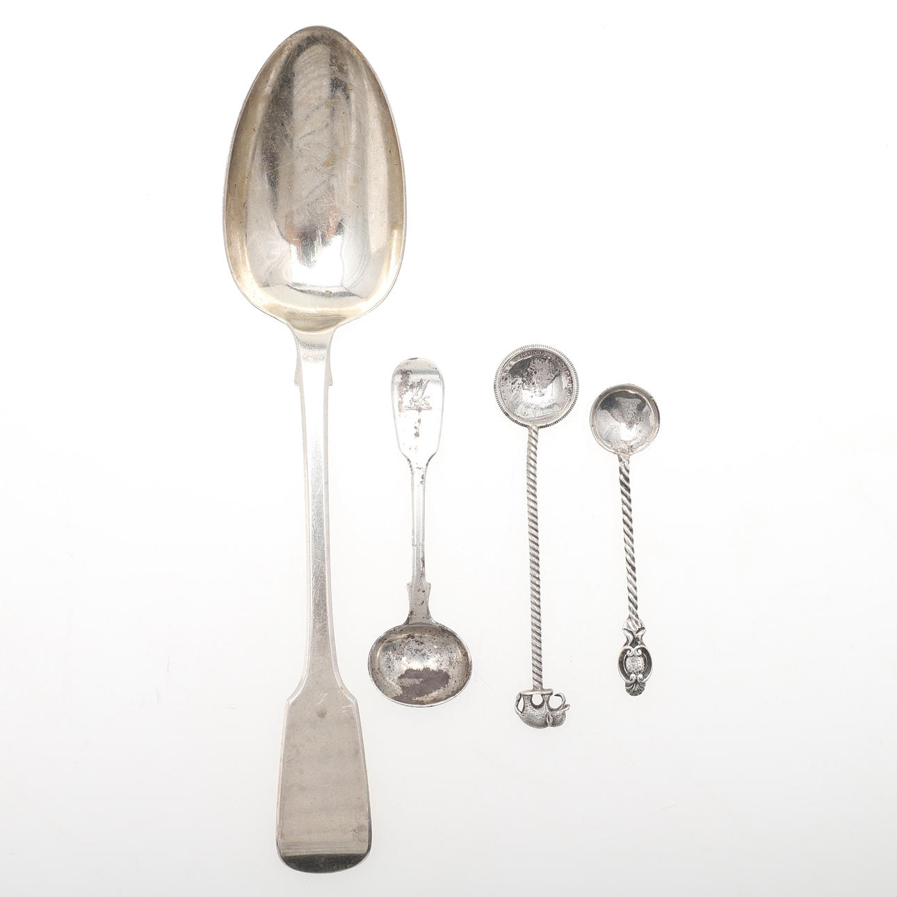 FOUR SILVER SPOONS.