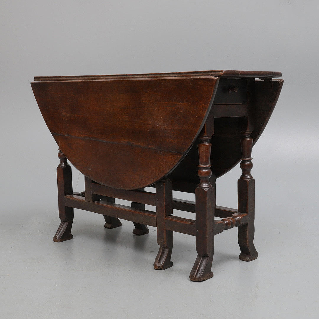 A CHARLES II OAK GATELEG TABLE.