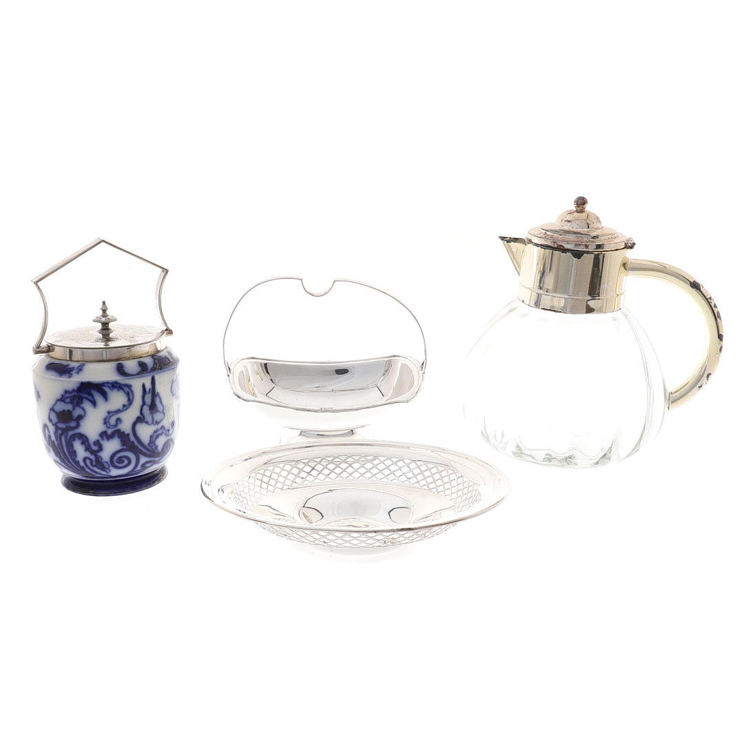 A CARLTON WARE BISCUIT BARREL WITH ELECTROPLATE MOUNTS.