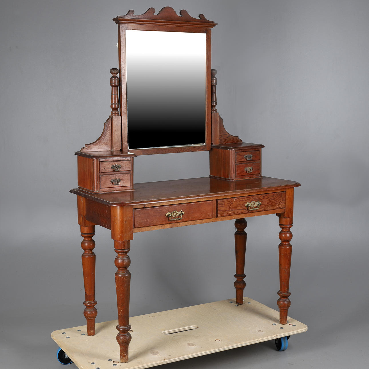 A LATE VICTORIAN PITCH PINE DRESSING TABLE.