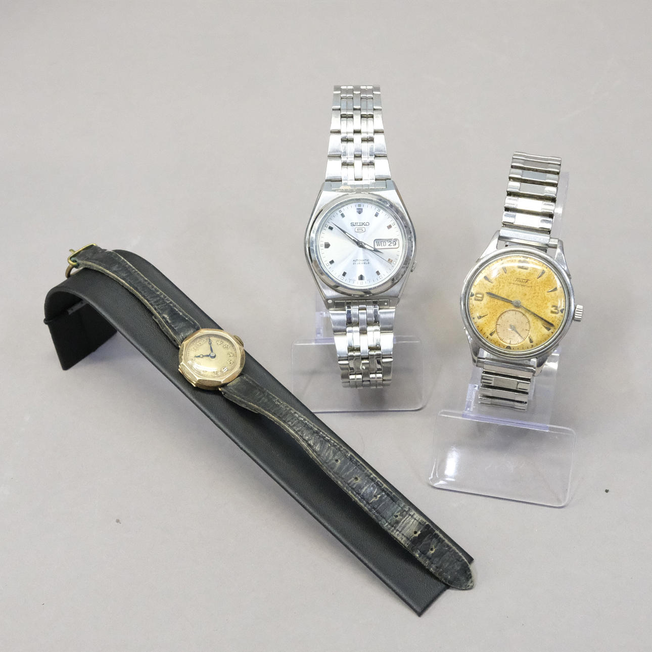 THREE WRISTWATCHES.