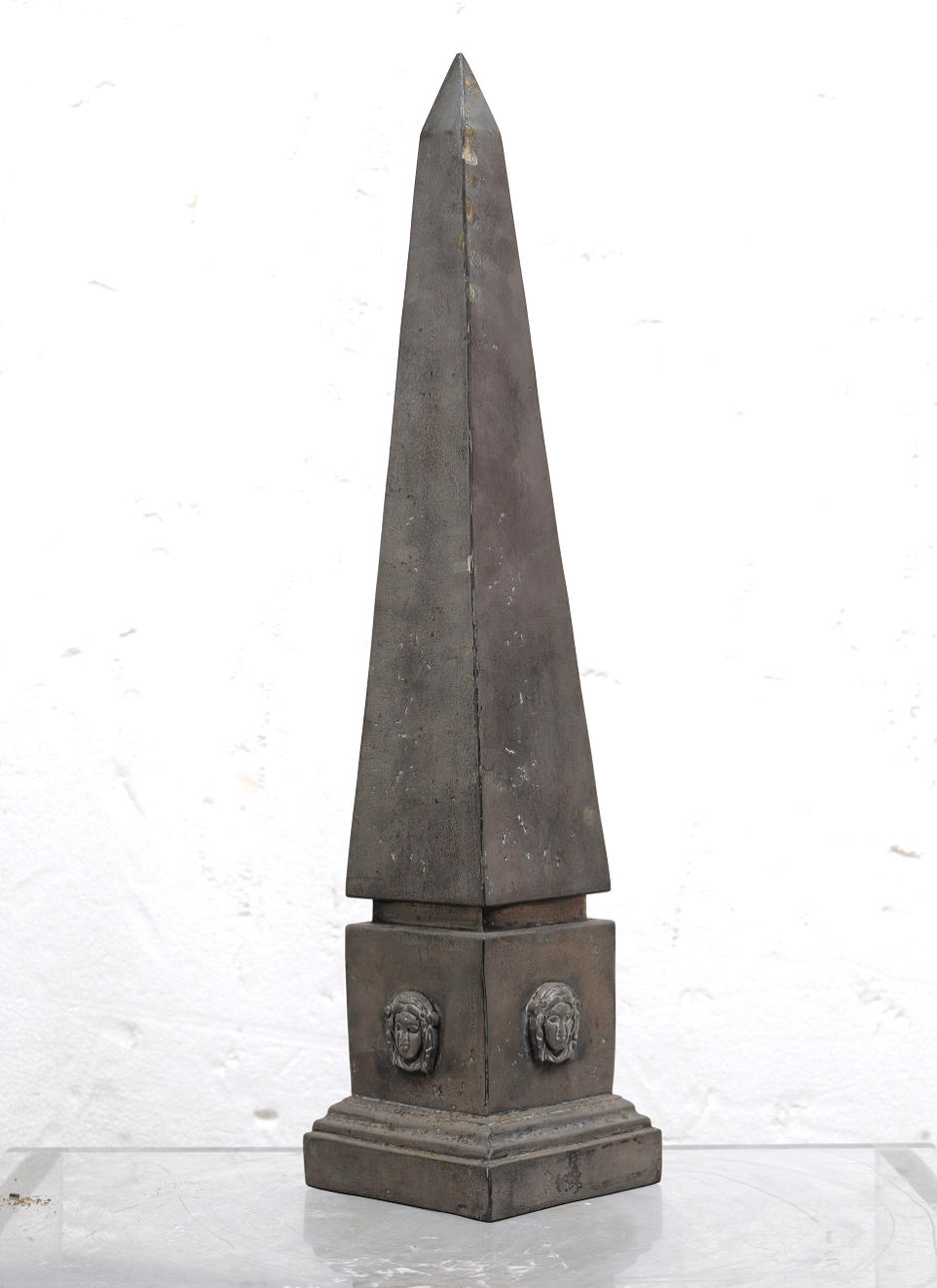 Tin obelisk.