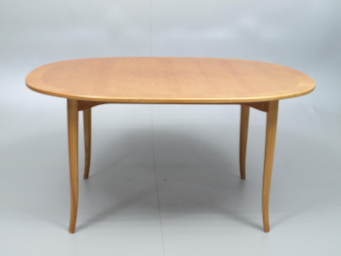 CARL MALMSTEN. Soffbord, olika träslag,"Ovalen", plakettmärkt.