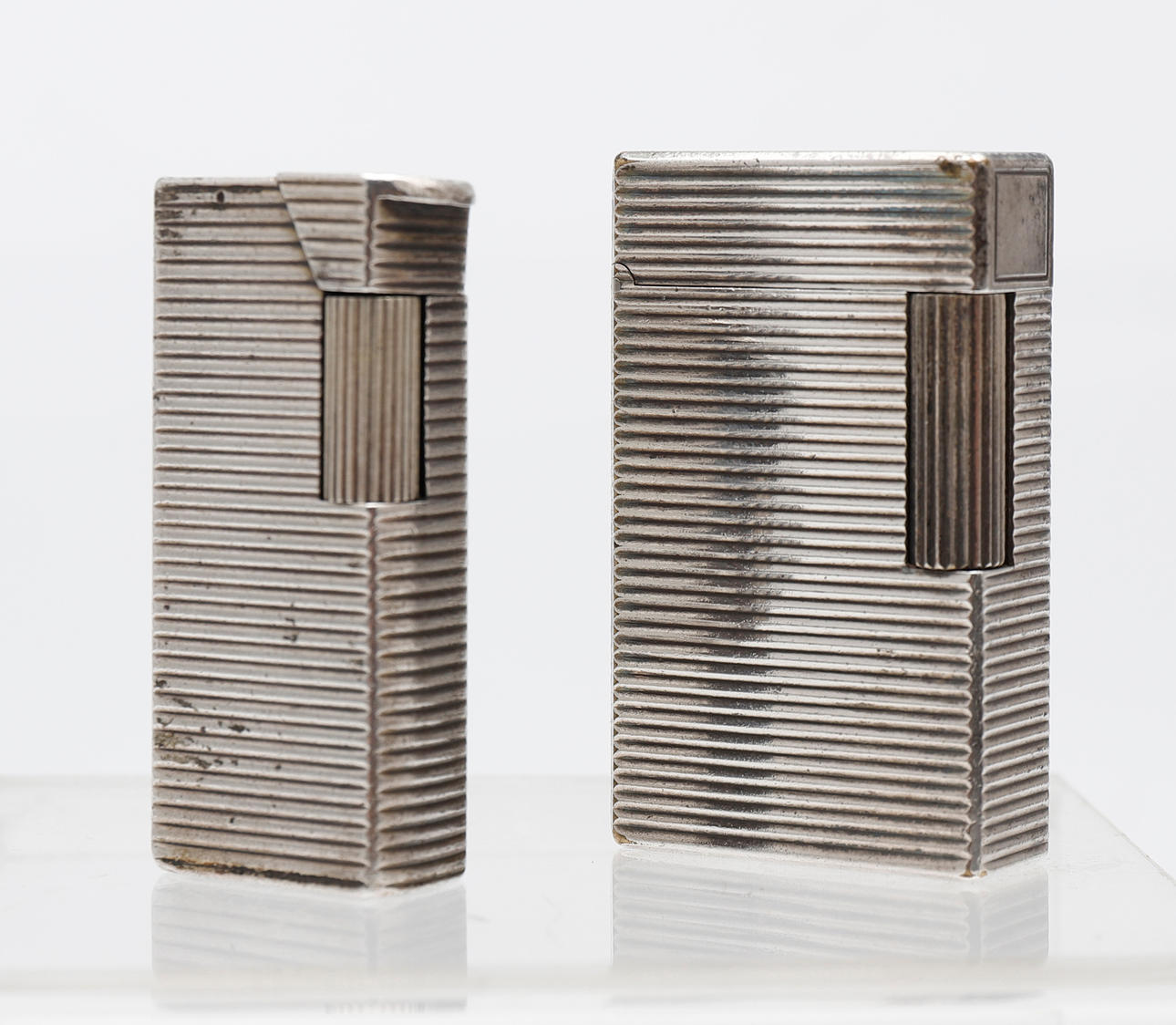 Two silver-plated French lighters.