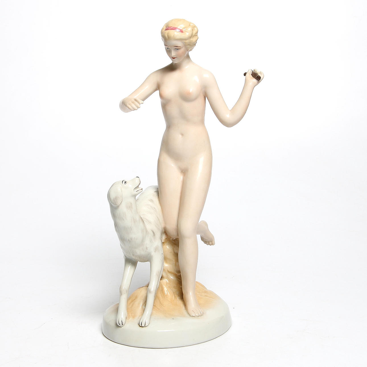 FIGURIN, porslin, kvinna med hund, sannolikt Tyskland, 1900-talets mitt. Stämplad.