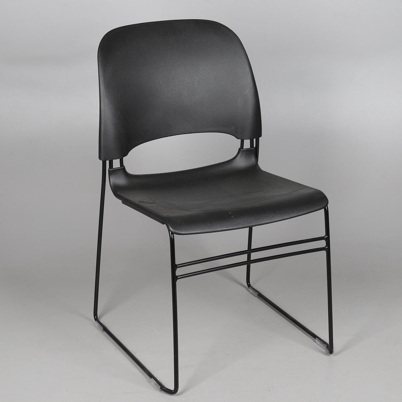 A HERMAN MILLER LIMERICK STACKING CHAIR.