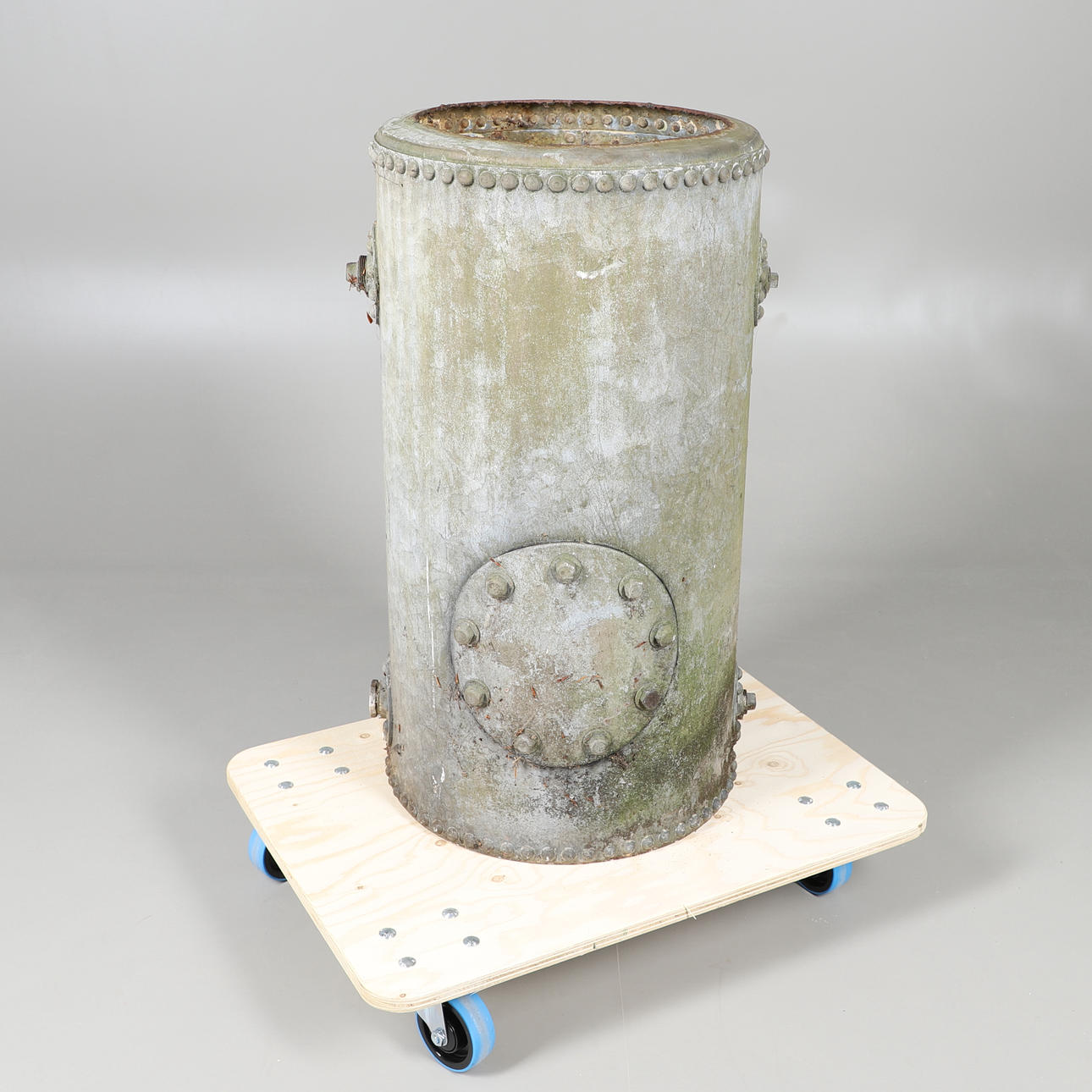 AN INDUSTRIAL RIVETED METAL WATER TANK.