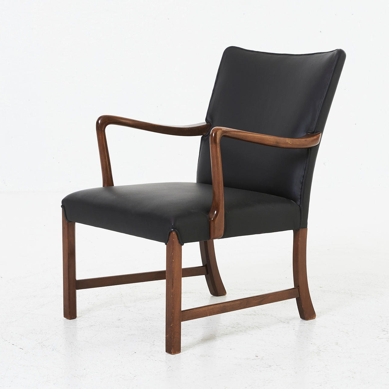 KARMSTOL, dark stained birch, covered in black leather, dated 1946.