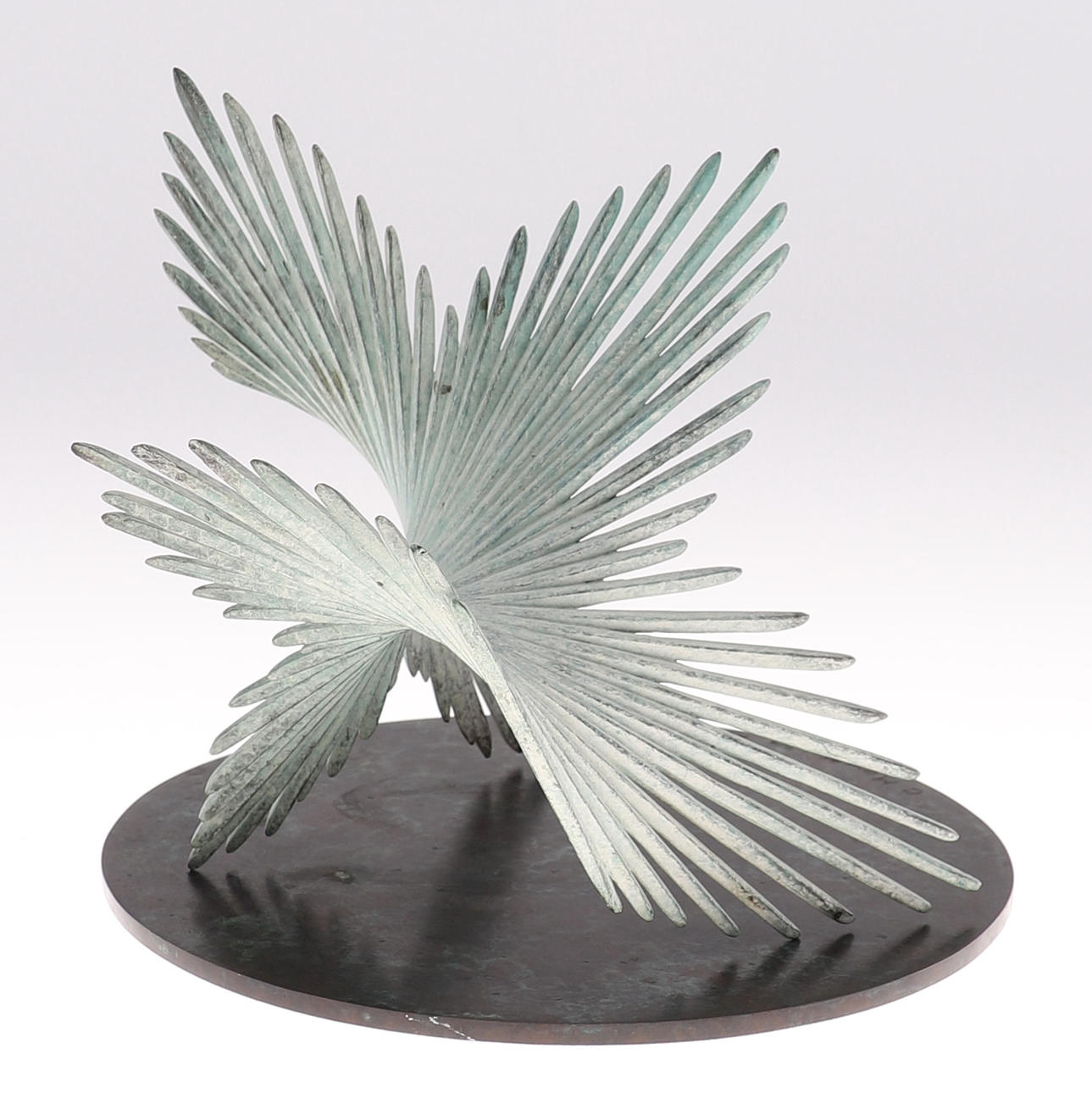 CHARLOTTE MAYER (BRITISH B1929) - BRONZE FEATHER SCULPTURE 'TURNING II'.