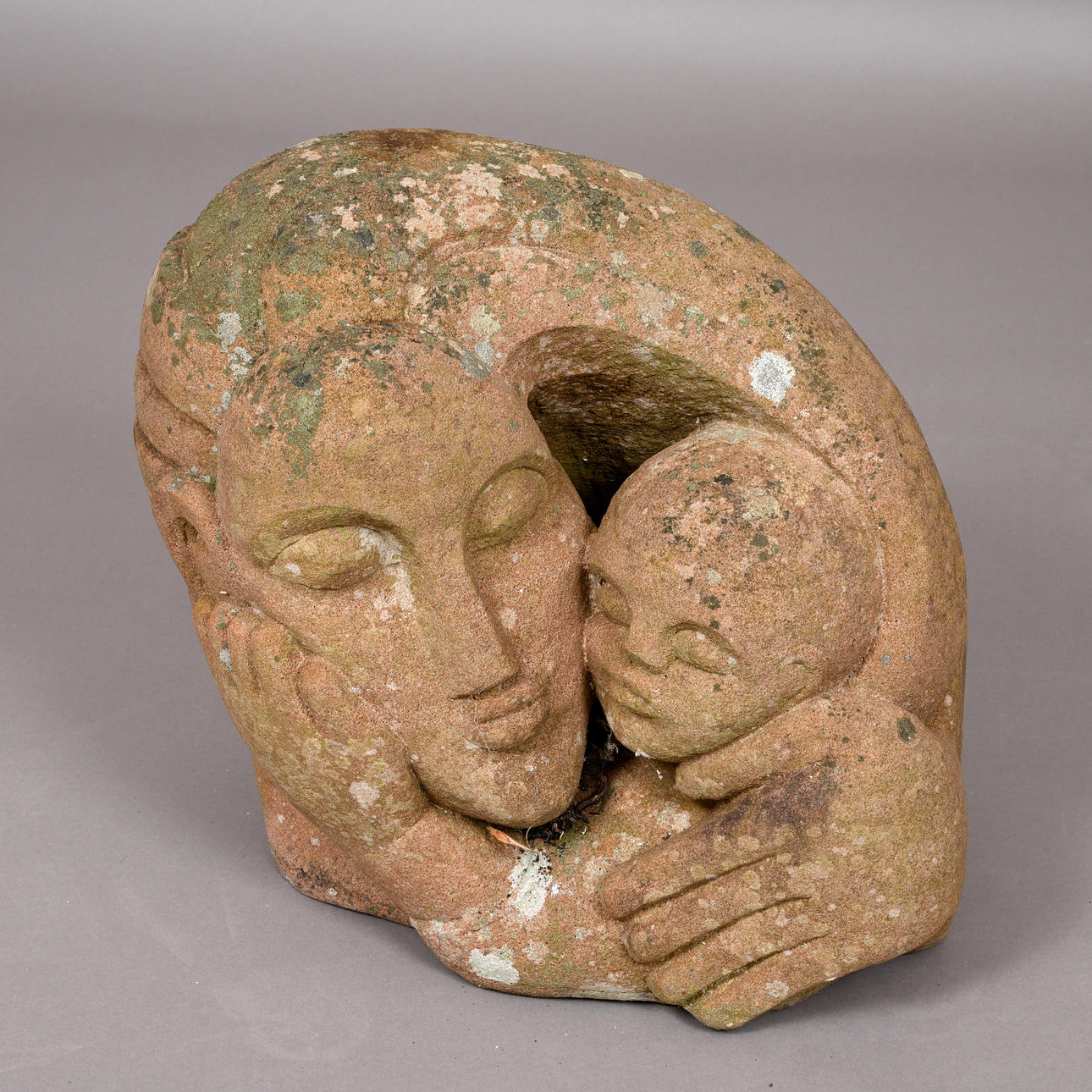 POLLY IONIDES (B 1944) - LARGE STONE SCULPTURE OF A MOTHER & CHILD.