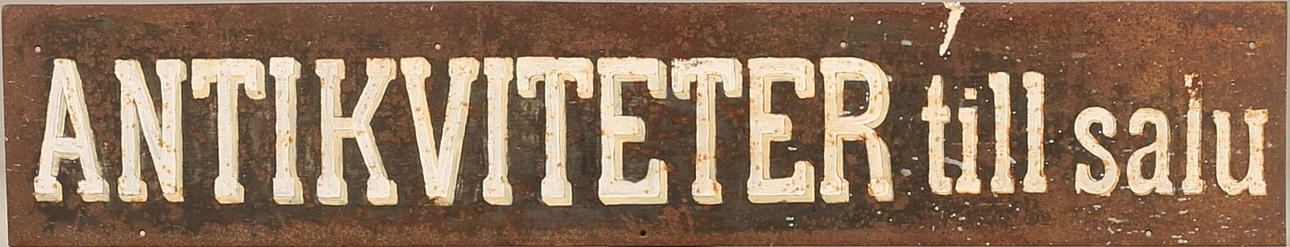 SKYLT, järn, "Antikviteter till salu".