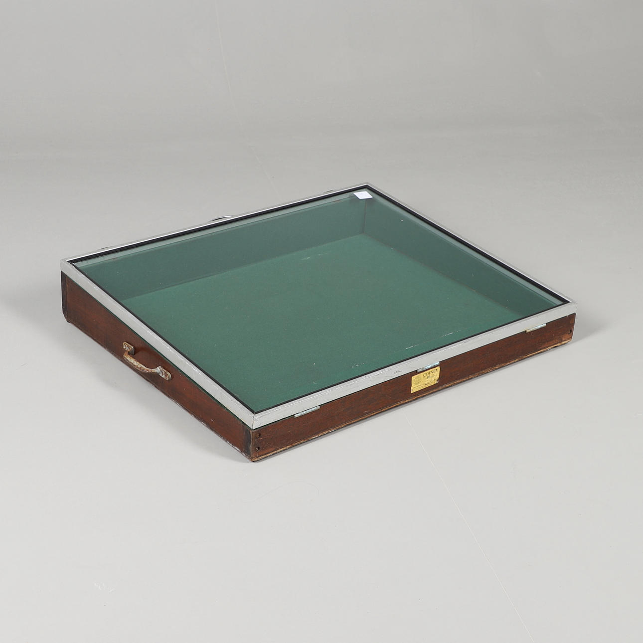 A SLOPED GLAZED WOOD AND METAL DISPLAY CASE. Furniture - Cupboards ...