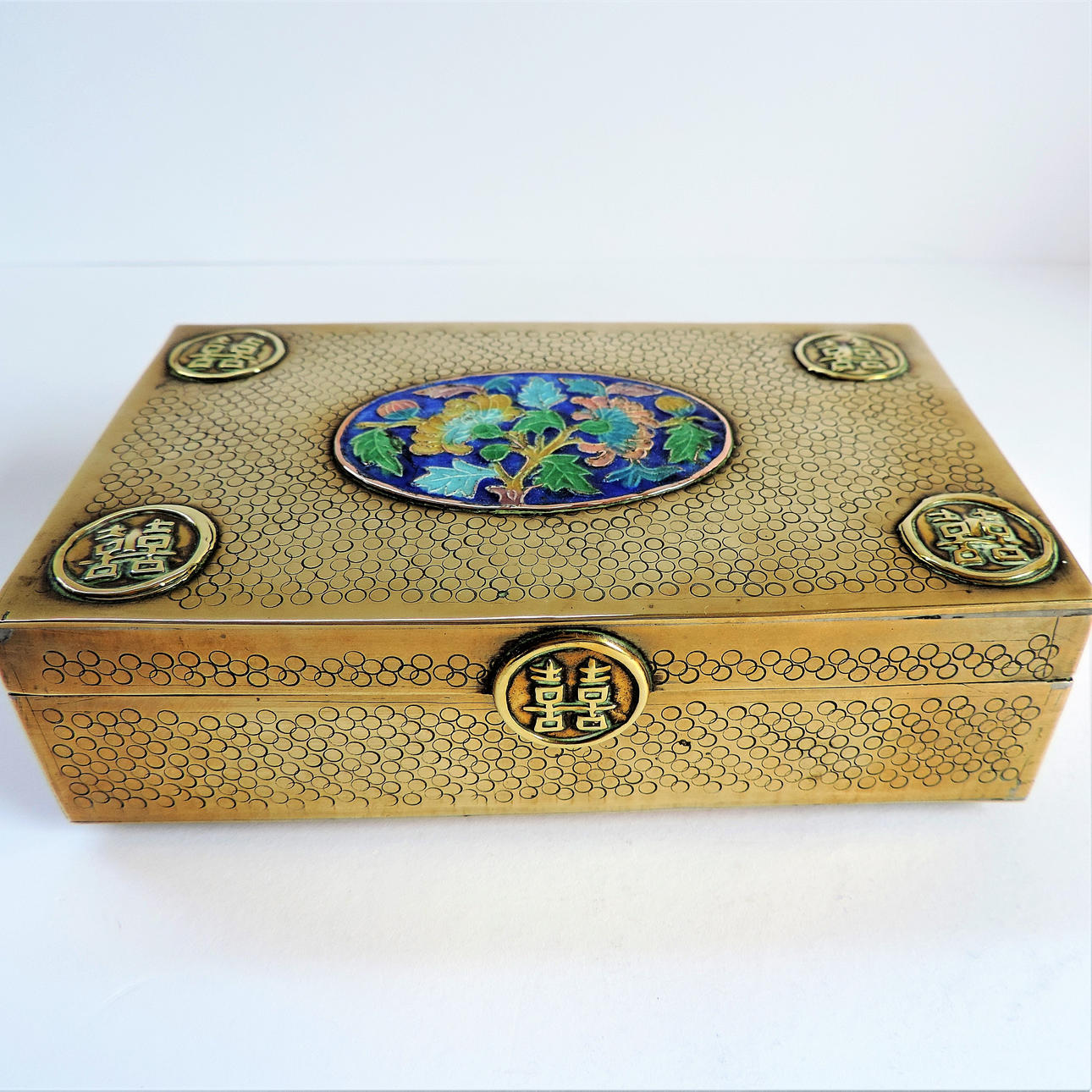 ANTIQUE CHINESE BRASS CIGARETTE BOX WITH CLOISONNE PANEL.