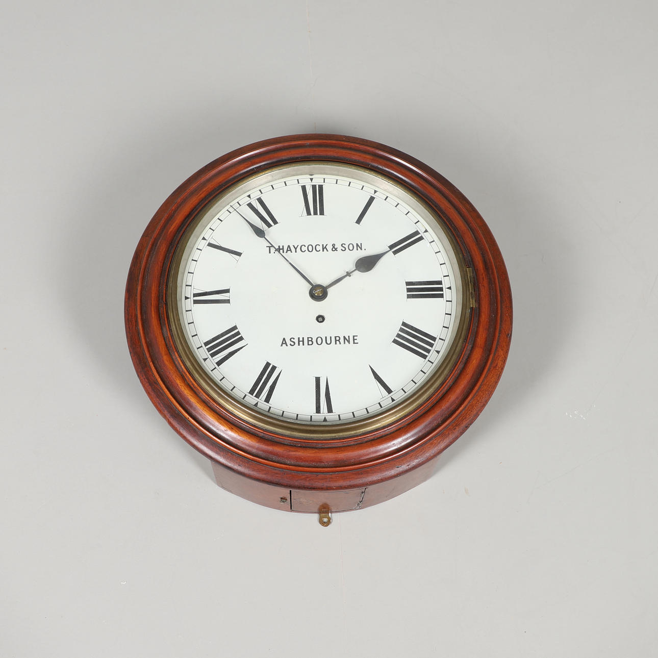 A VICTORIAN MAHOGANY WALL CLOCK.