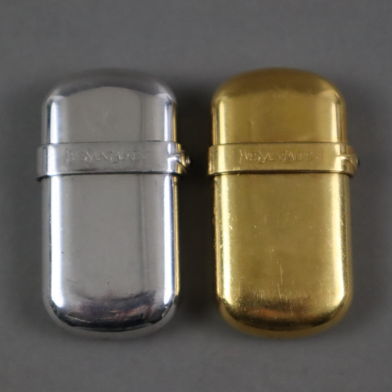 - 2 LIGHTERS - Yves Saint Laurent, Paris.