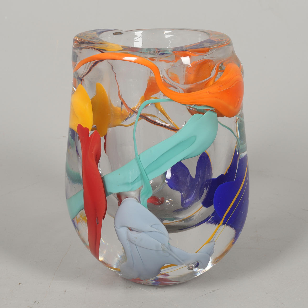 A MULTICOLOURED GLASS VASE.