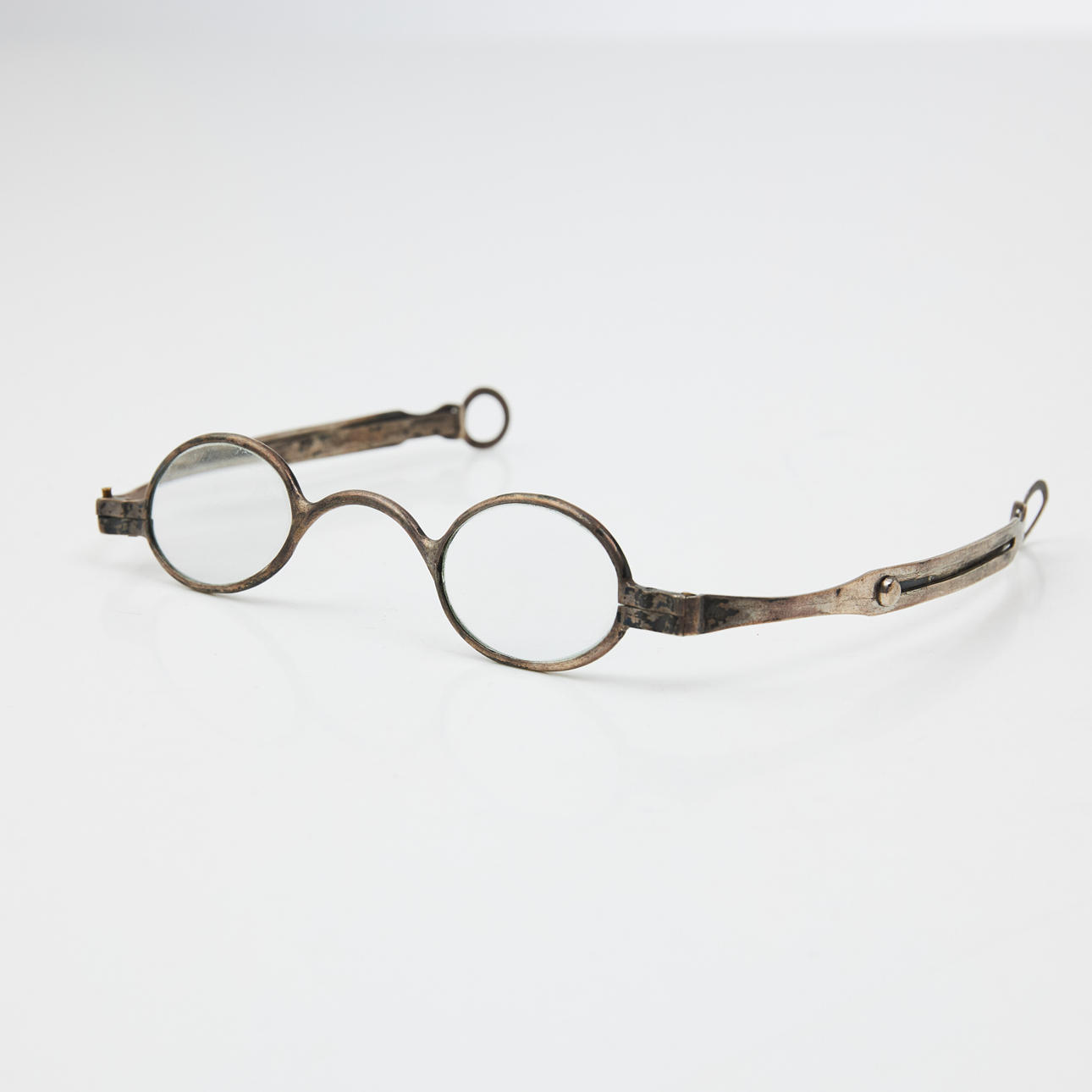 GLASSES, early 19th century, steel frames, extendable temples, marked with maker's monogram (LMM).