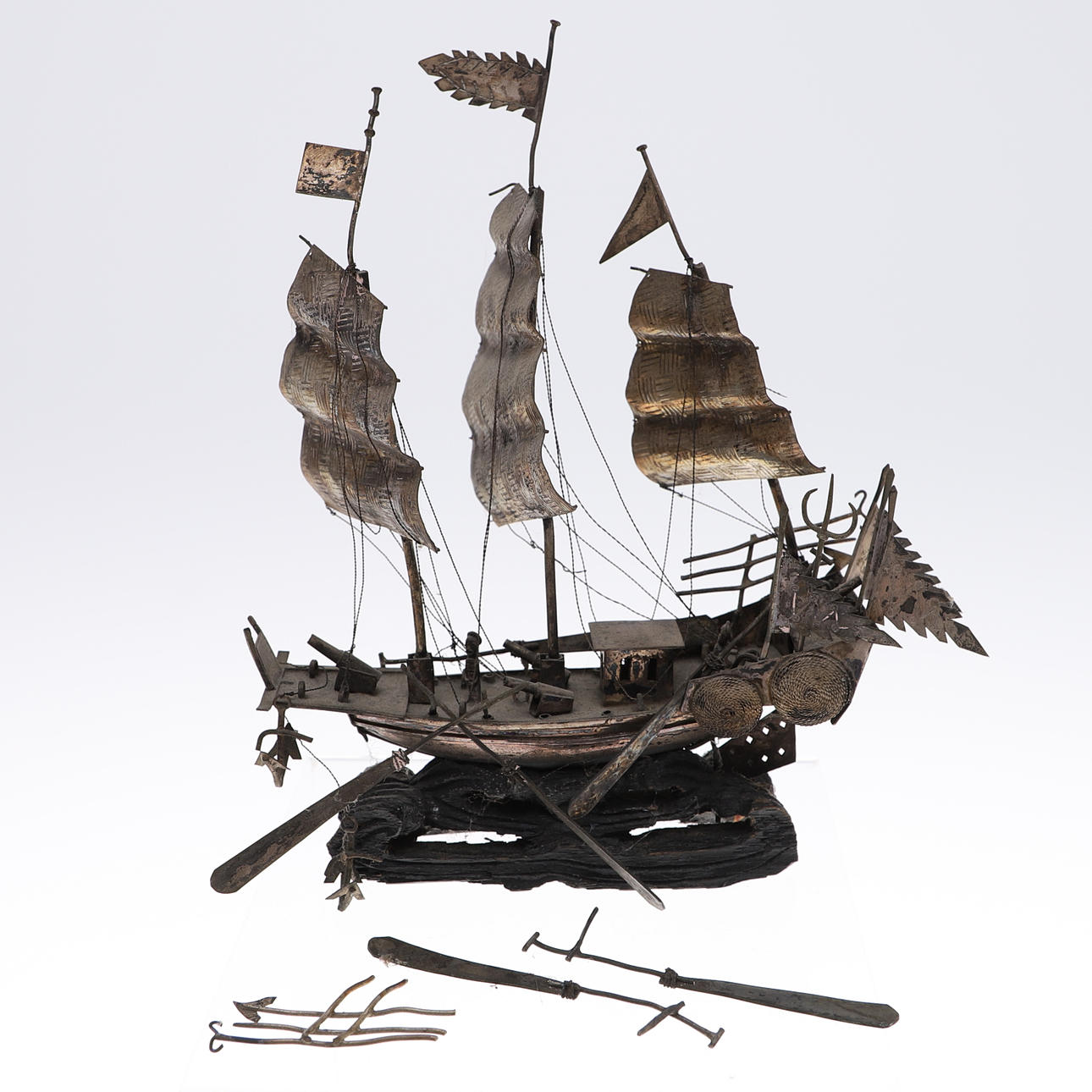 A MINIATURE SILVER MODEL SAILING SHIP.
