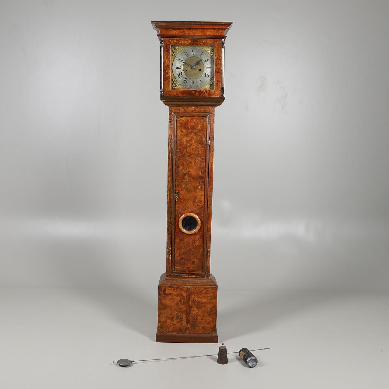 A PROVINCIAL POLLARD OAK LONGCASE CLOCK.