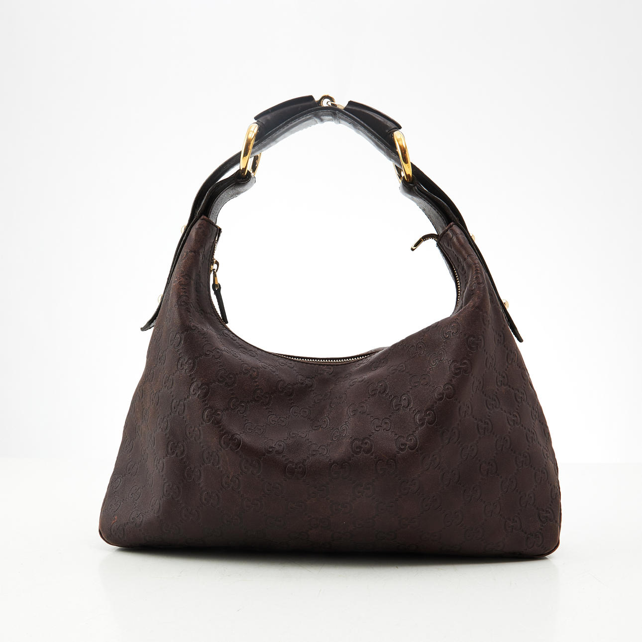 GUCCI, shoulder bag, monogram patterned brown leather, handle with gold plated details, textile lining inside with patterned textile lining with bridle motif, one zipped pocket, 2000s.