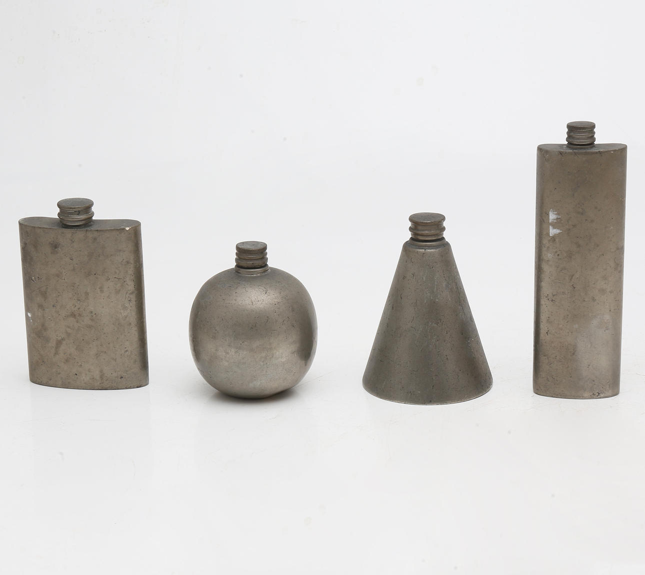 Four English pewter flasks, second third of the 20th entury.