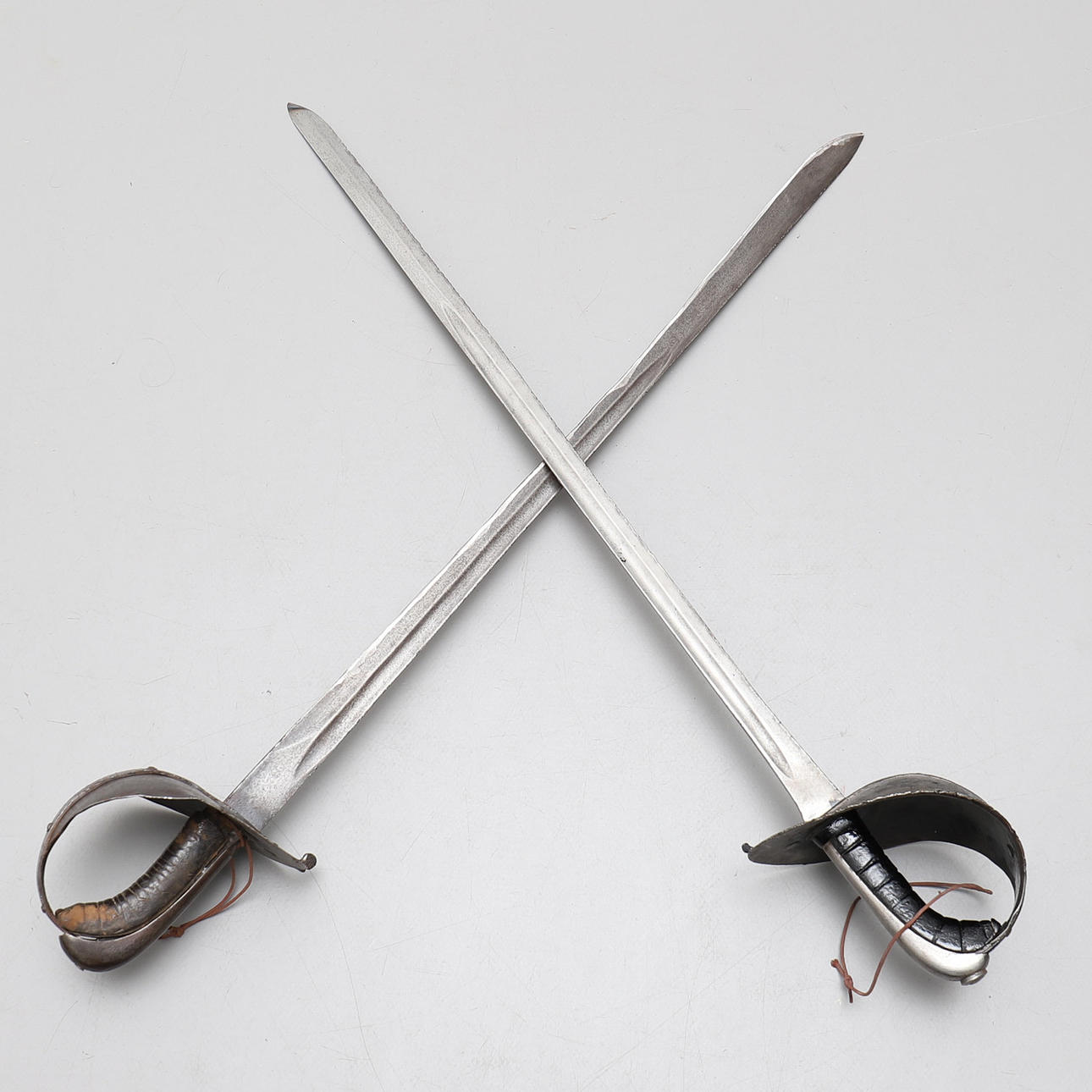 PRACTICE SABERS, TWO PIECES, 19TH CENTURY.
