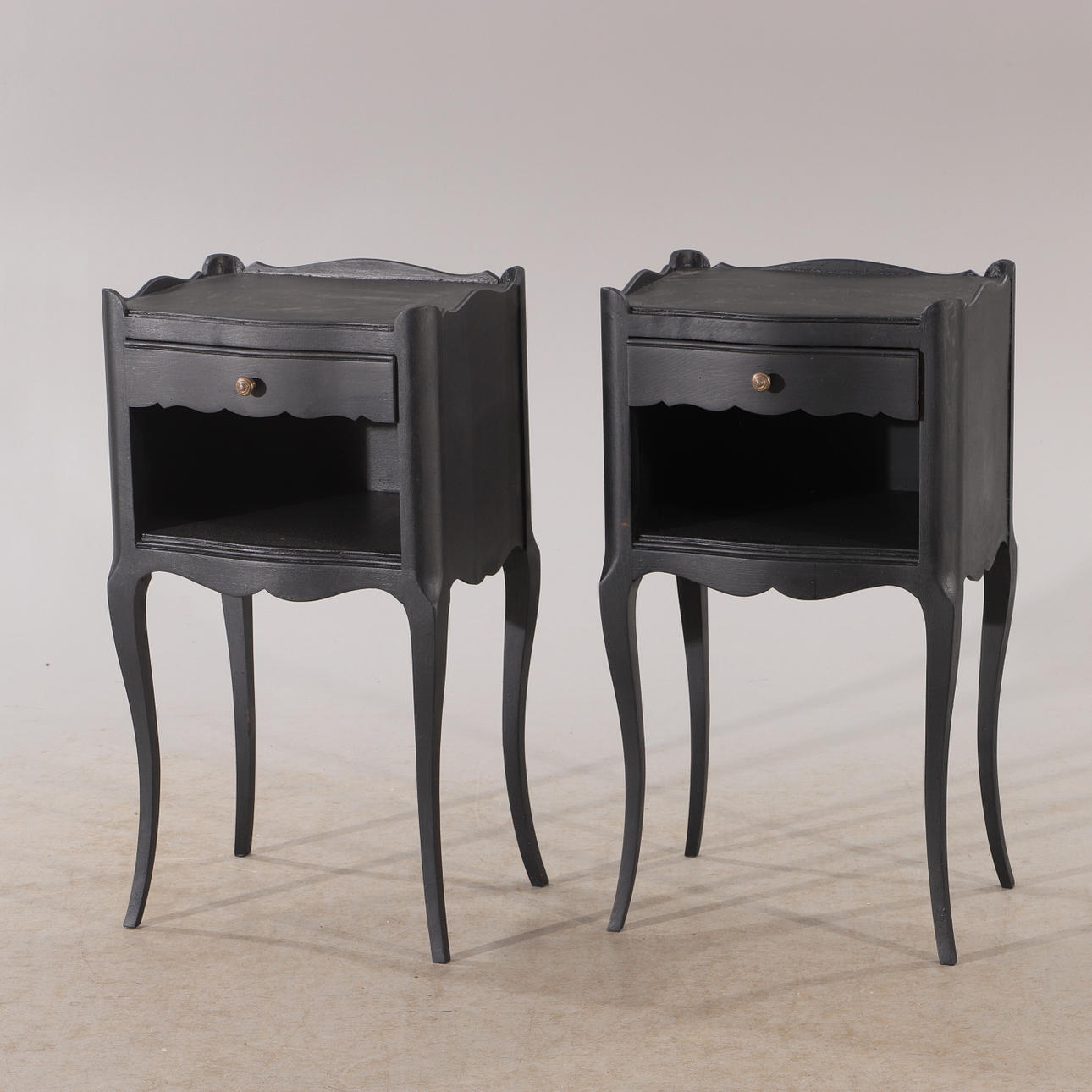 BEDSIDE TABLES, 1 pair, black painted, rococo style.