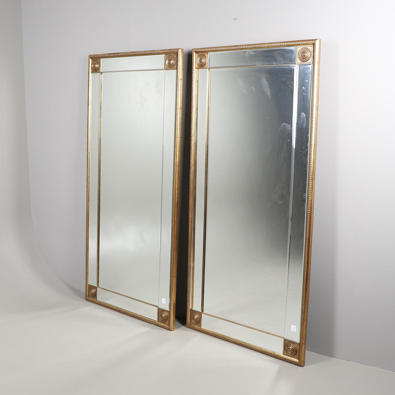A PAIR OF LARGE RECTANGULAR WALL MIRRORS.