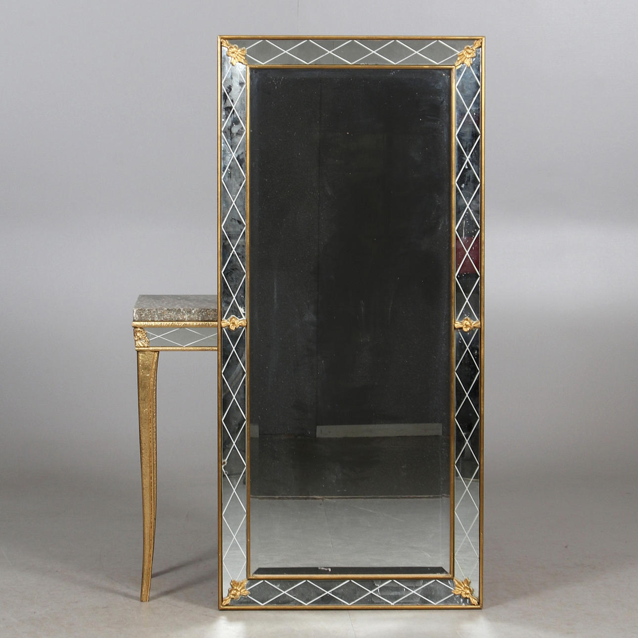 MIRROR with CONSOLE TABLE, gilded wood, stone, mid 20th century.