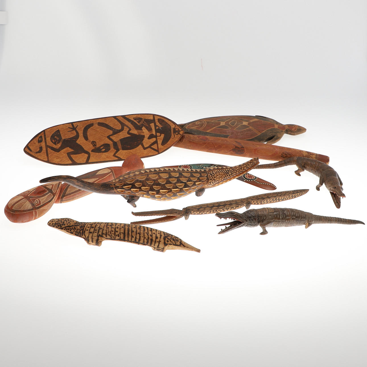TEN ABORIGINAL CARVED WOODEN ITEMS.