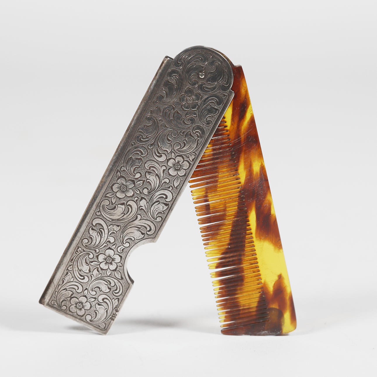 CHISELED SILVER COMB COVER.