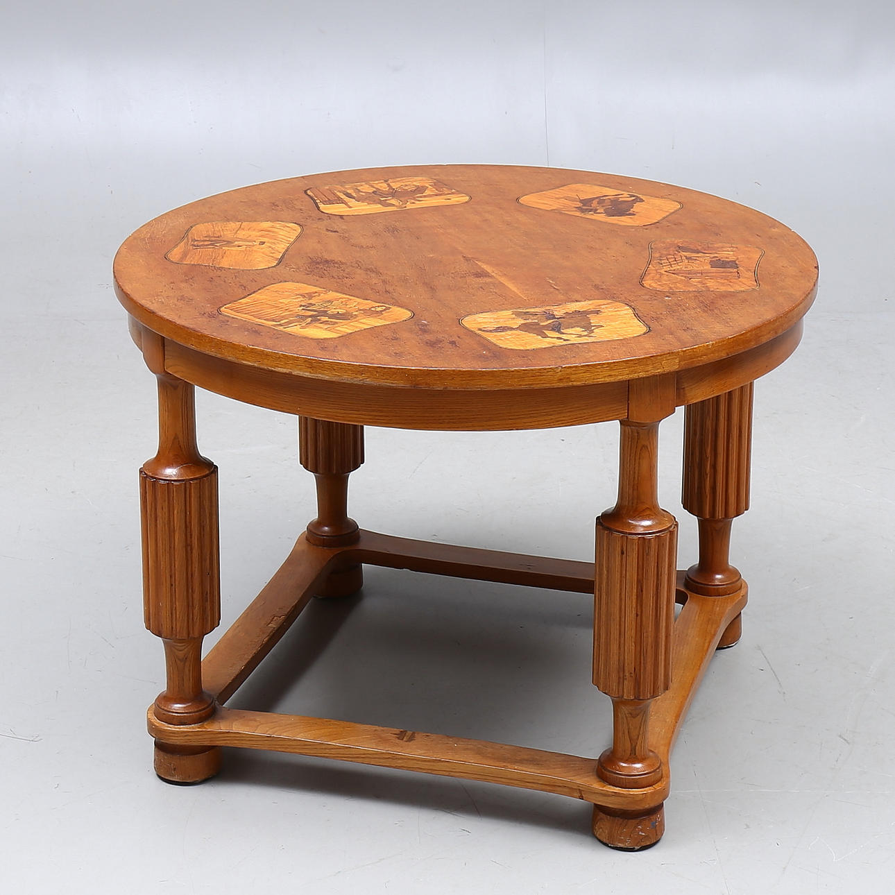 TABLE, wood with intarsia decor, dated 1942.