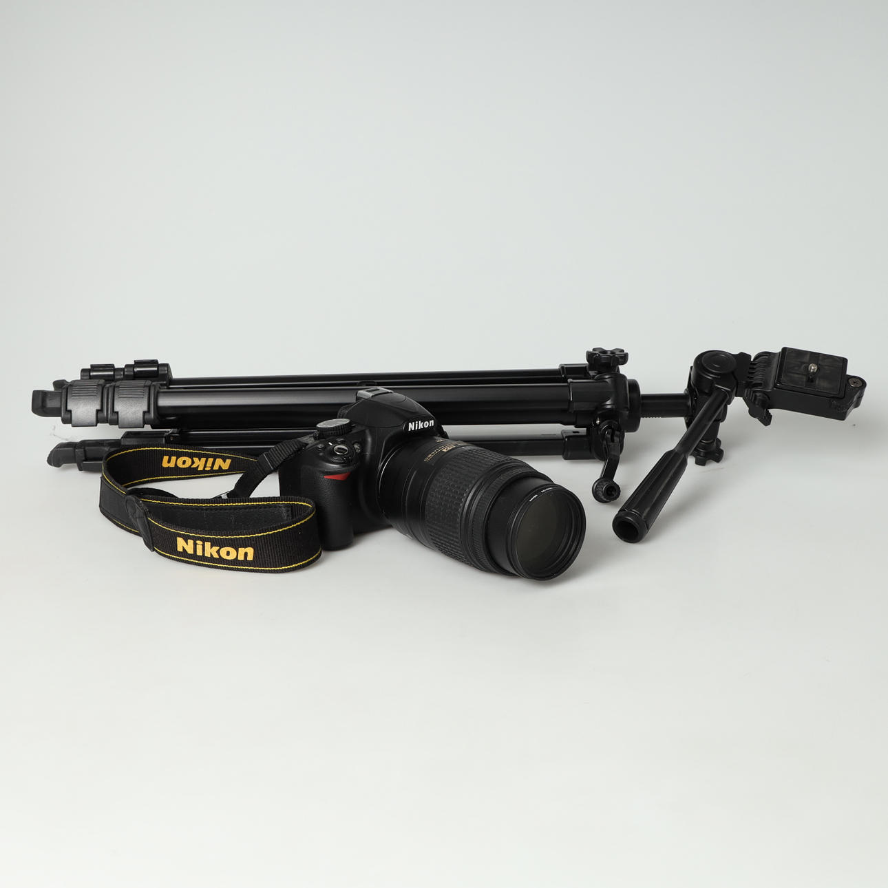 DIGITAL CAMERA, NIKON D3100 and lens.