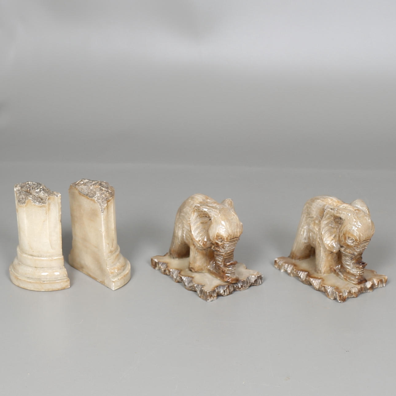 BOOK SUPPORT in alabaster, 4 pcs, 20th century.