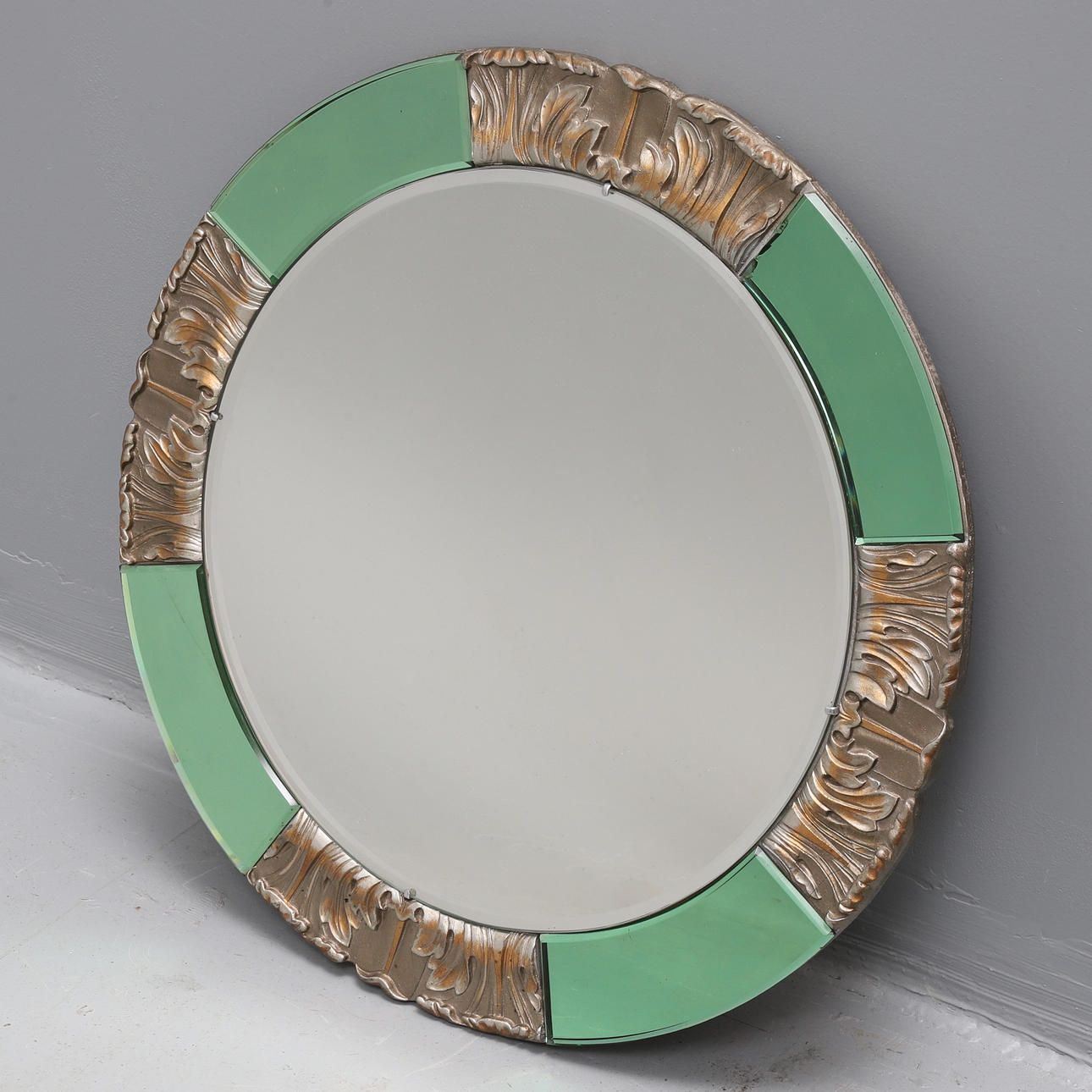 AN ART DECO CIRCULAR WALL MIRROR, BY ATSONEA.