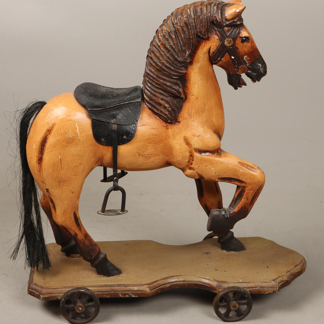 TOY HORSE on wheels, 1900s.