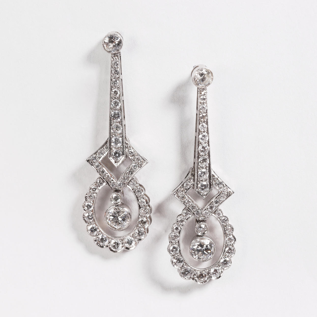 CIRCA 1900 LONG MOBILE DIAMOND AND PLATINUM EARRINGS.
