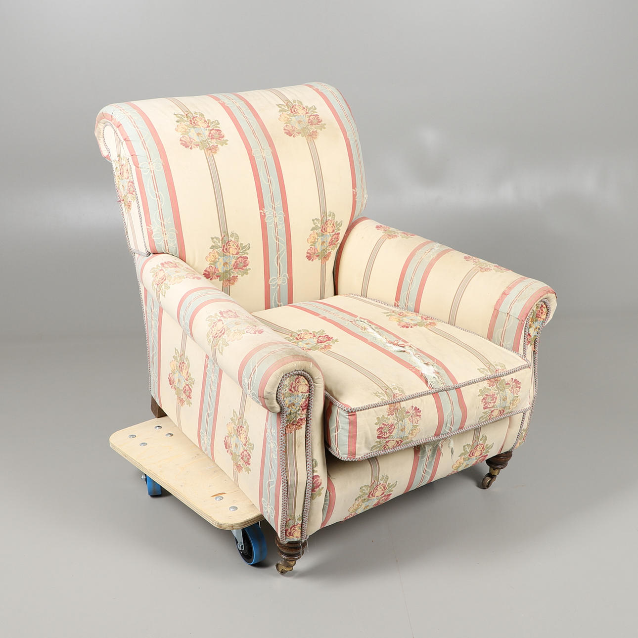 A PETER DUDGEON FLORAL ARMCHAIR.