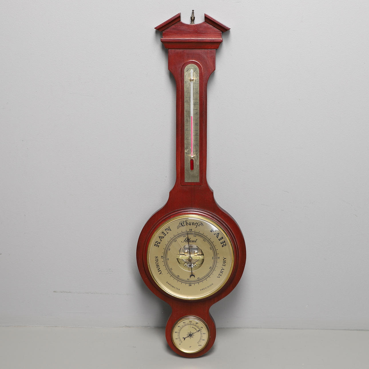 A MODERN WALL MOUNTED BAROMETER.