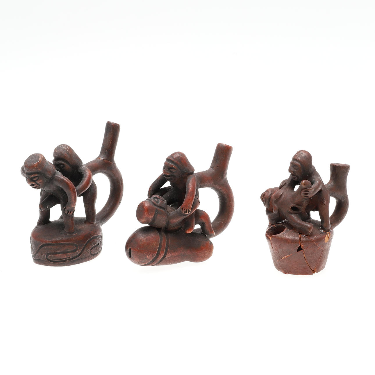 THREE MOCHE PERUVIAN POTTERY EROTIC PIPES.