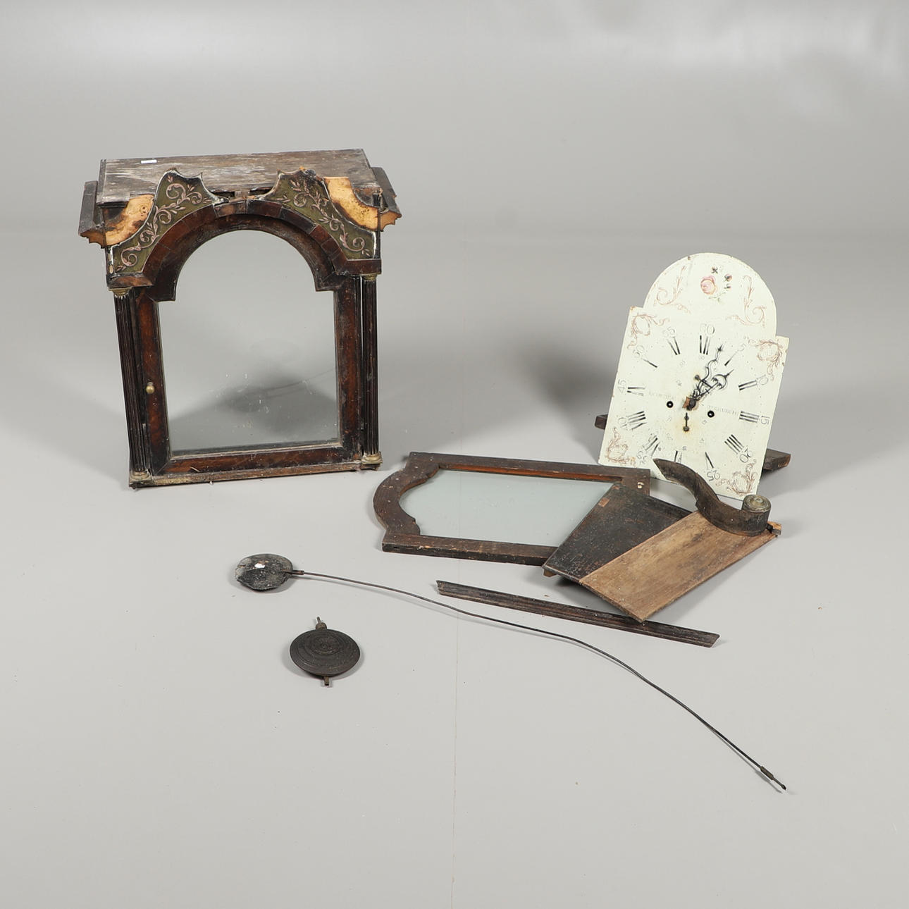 AN OAK LONGCASE CLOCK HOOD, MOVEMENT AND VARIOUS SPARES.