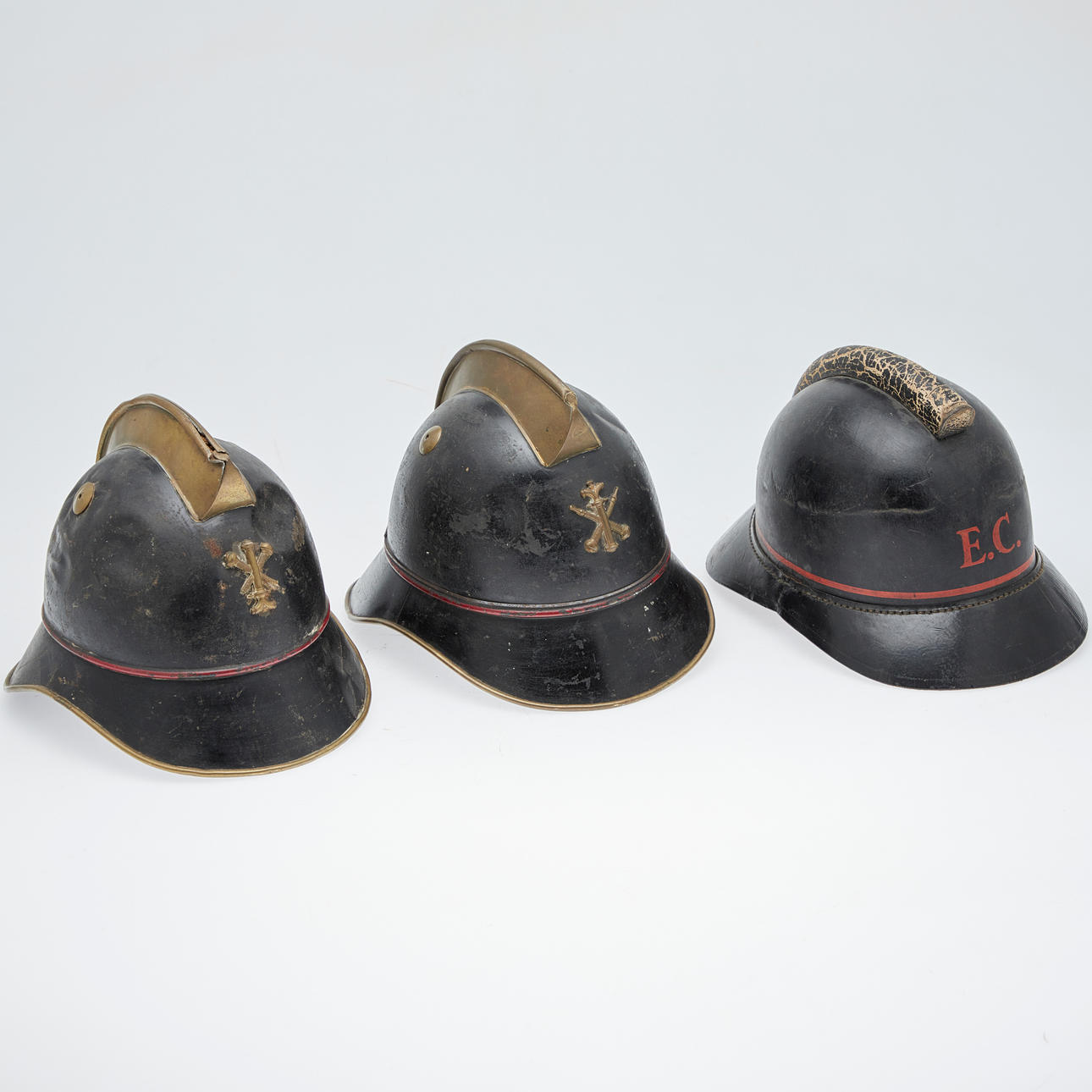 Helmets / fire helmets, leather, metal, around 1910 (3).