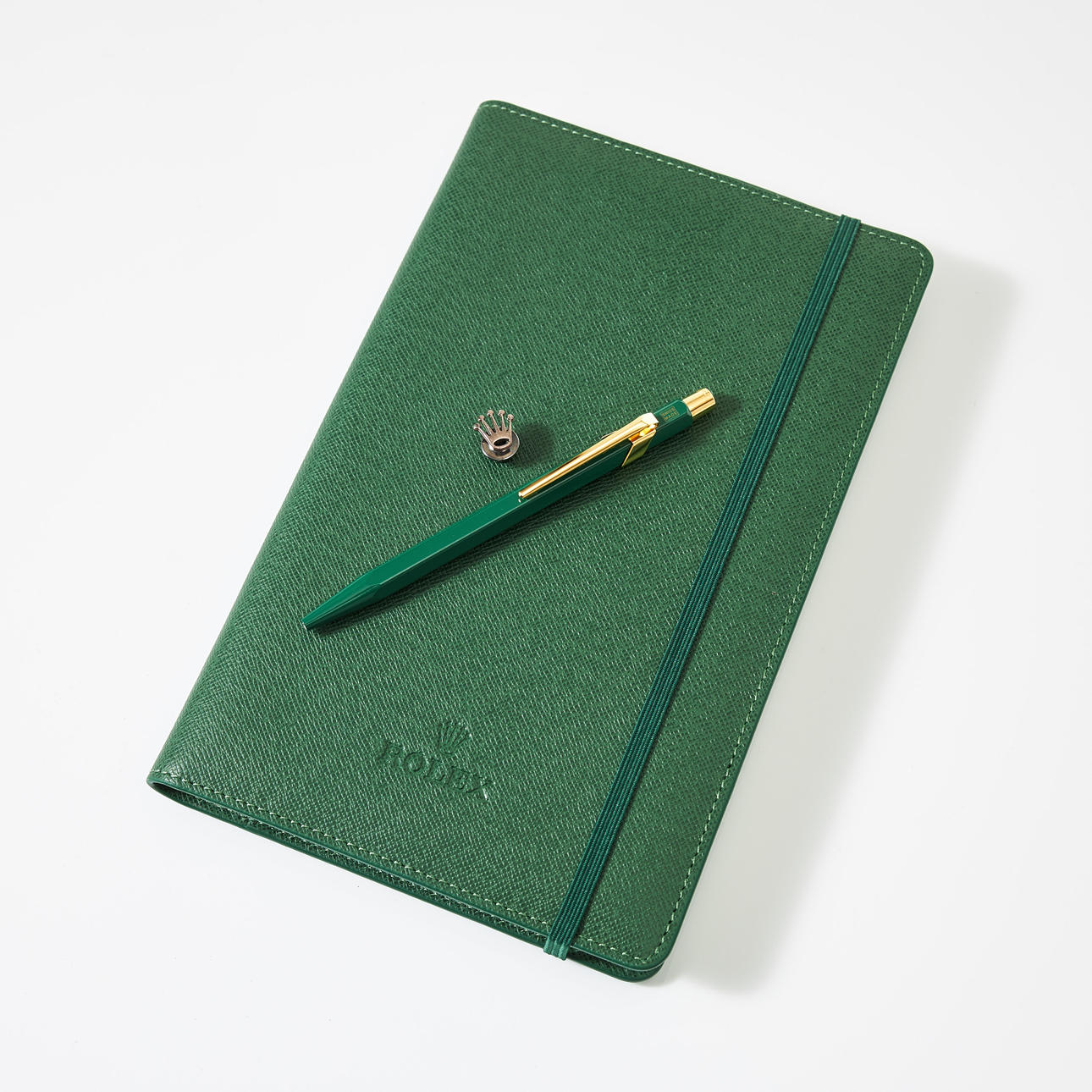 ROLEX, notebook with leather case, lapel pin, ballpoint pen.